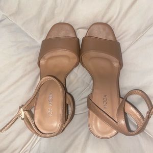 Like new Tan/nude heels with adjustable ankle strap. Size 7, only worn once.
